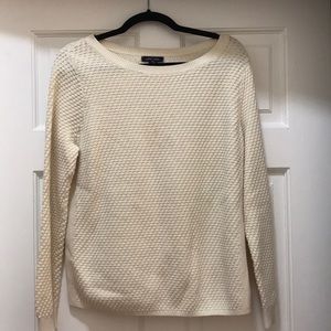 A cream pullover sweater